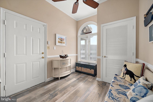 201 S Heron Dr Unit 9B, Ocean City, MD 21842 - foyer entrance featuring a ceiling fan, baseboards, ornamental molding, and light wood finished floors