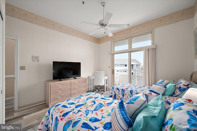 201 S Heron Dr Unit 9B, Ocean City, MD 21842 - bedroom featuring access to outside, ceiling fan, and light wood-type flooring