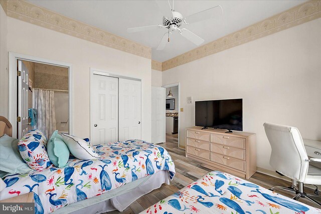201 S Heron Dr Unit 9B, Ocean City, MD 21842 - bedroom with a closet, a ceiling fan, and wood finished floors