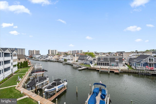 201 S Heron Dr Unit 9B, Ocean City, MD 21842 - view of water feature featuring a boat dock, boat lift, and a residential view