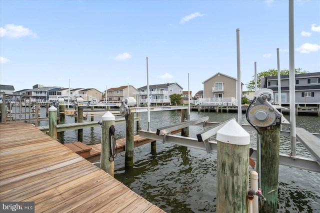 201 S Heron Dr Unit 9B, Ocean City, MD 21842 - view of dock featuring a residential view, boat lift, and a water view