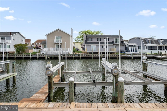201 S Heron Dr Unit 9B, Ocean City, MD 21842 - view of dock featuring boat lift, a water view, and a residential view