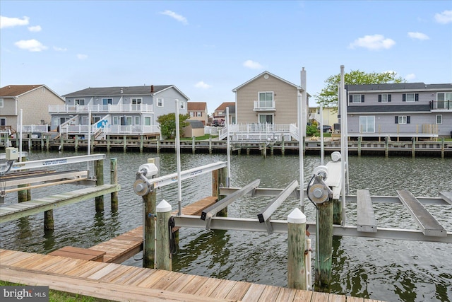 201 S Heron Dr Unit 9B, Ocean City, MD 21842 - view of dock featuring boat lift, a residential view, and a water view