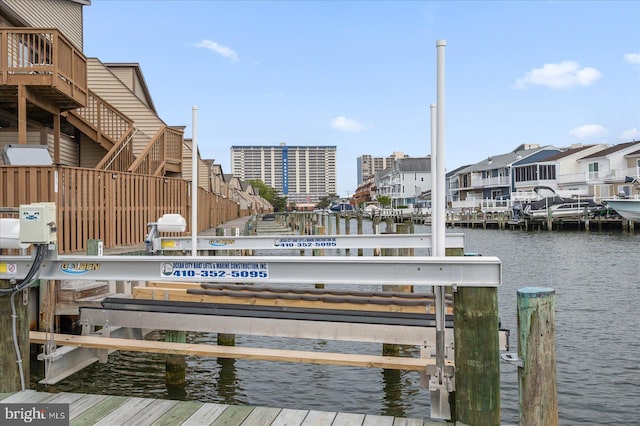 201 S Heron Dr Unit 9B, Ocean City, MD 21842 - dock area with boat lift, a residential view, and a water view