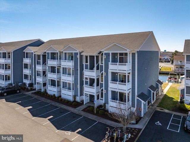 201 S Heron Dr Unit 9B, Ocean City, MD 21842 - view of building exterior featuring uncovered parking