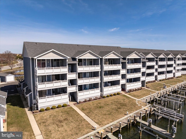 201 S Heron Dr Unit 9B, Ocean City, MD 21842 - view of building exterior with a water view and boat lift