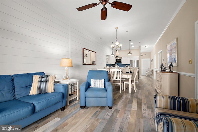 201 S Heron Dr Unit 9B, Ocean City, MD 21842 - living area featuring a ceiling fan and light wood-type flooring