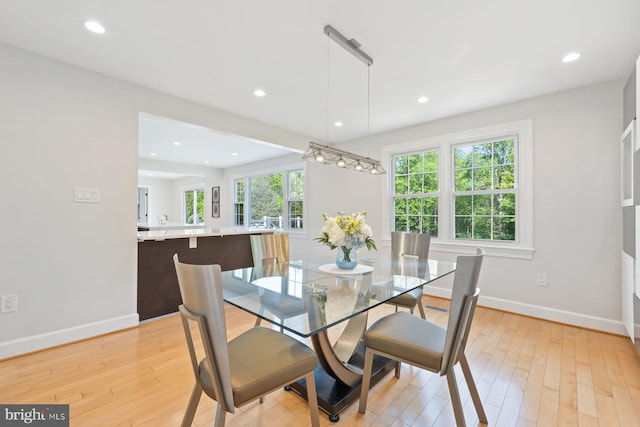 dining area featuring light wood-type flooring, recessed lighting, and baseboards