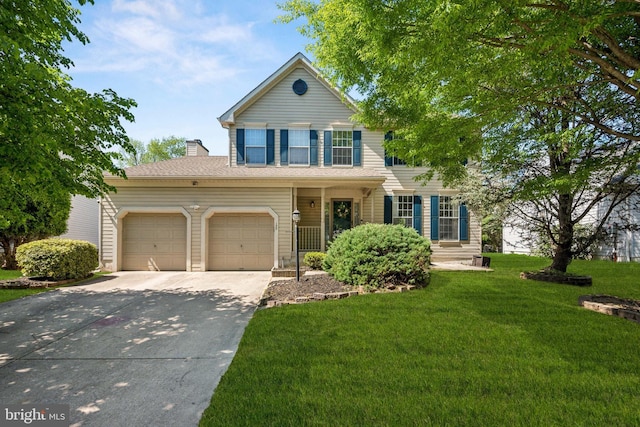 traditional-style home with concrete driveway, a chimney, a front yard, and a garage