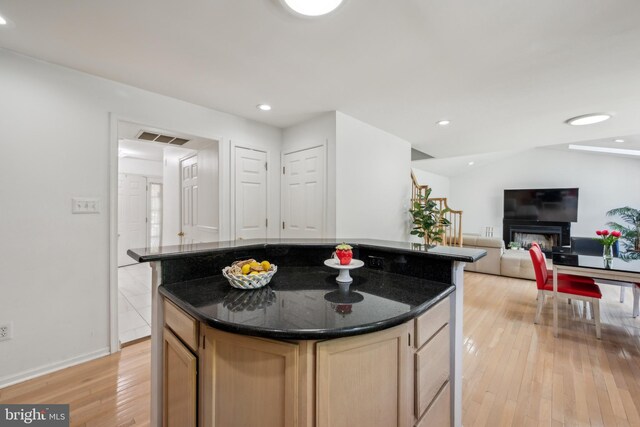 kitchen featuring visible vents, light brown cabinetry, a kitchen island, light wood-style floors, and recessed lighting