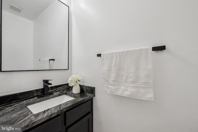 bathroom with visible vents and vanity