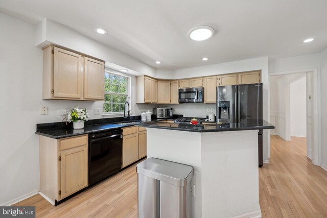 kitchen featuring light brown cabinetry, a sink, black dishwasher, stainless steel microwave, and fridge with ice dispenser