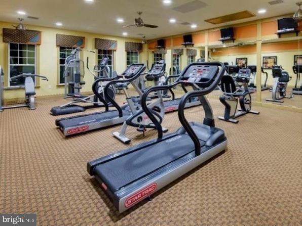 exercise room with recessed lighting, ceiling fan, and carpet floors