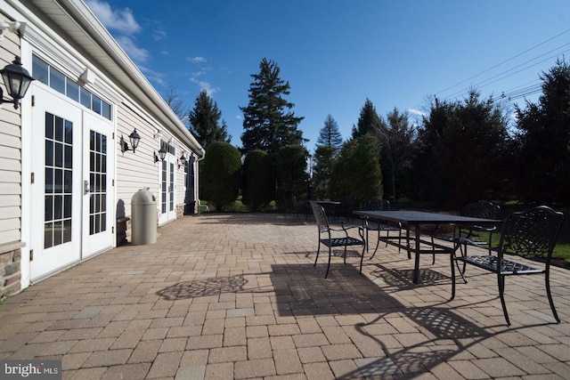 view of patio featuring french doors and outdoor dining area