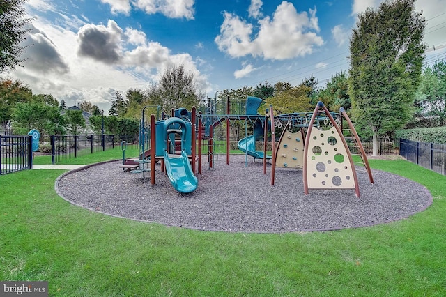 community playground featuring fence and a lawn