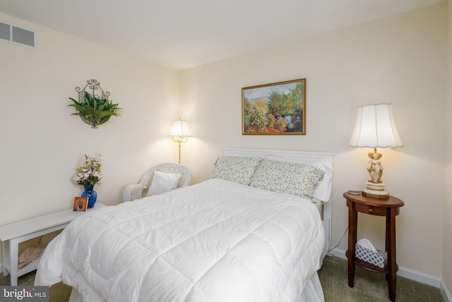 bedroom featuring visible vents, carpet floors, and baseboards