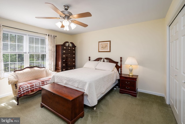 carpeted bedroom featuring baseboards, a ceiling fan, and a closet