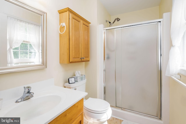 full bath with a shower stall, toilet, and vanity