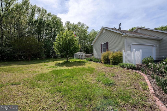 view of yard featuring a garage