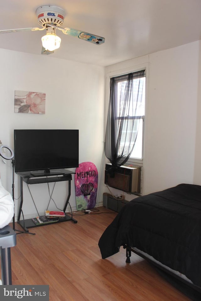 bedroom with wood finished floors