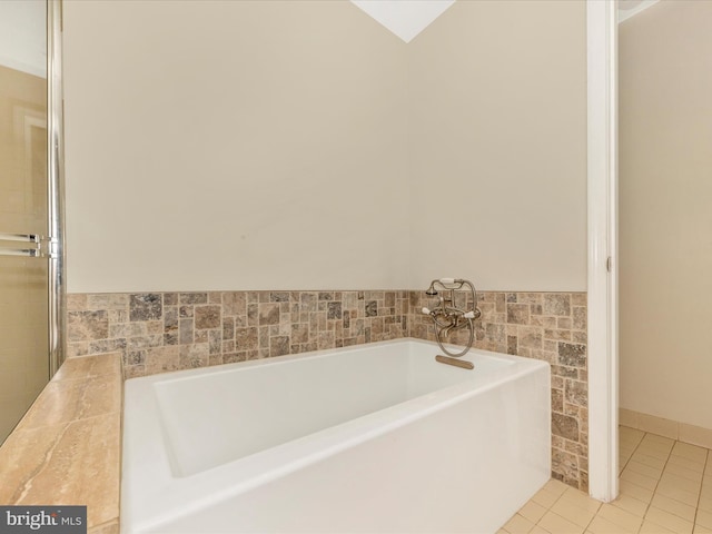 20216 Tidewinds Way, Germantown, MD 20874 - full bathroom featuring a garden tub, tile patterned floors, tile walls, and wainscoting