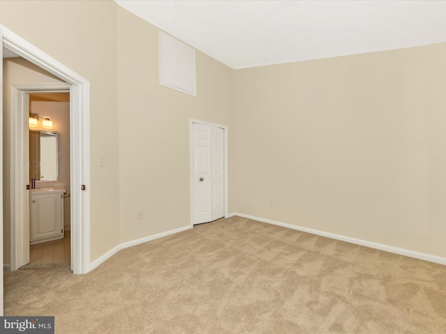 20216 Tidewinds Way, Germantown, MD 20874 - unfurnished bedroom with light carpet, baseboards, and a towering ceiling