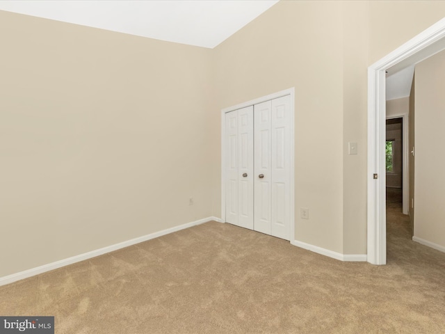 20216 Tidewinds Way, Germantown, MD 20874 - unfurnished bedroom with carpet, a closet, baseboards, and a towering ceiling