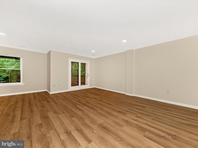 20216 Tidewinds Way, Germantown, MD 20874 - unfurnished room featuring healthy amount of natural light, wood finished floors, baseboards, and recessed lighting