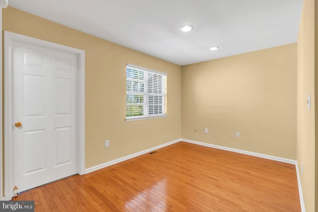 unfurnished bedroom featuring baseboards, recessed lighting, and light wood-style flooring