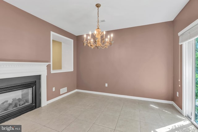 unfurnished living room with an inviting chandelier, light tile patterned floors, baseboards, and visible vents
