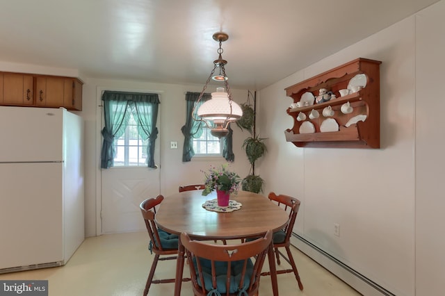 dining area featuring a baseboard radiator