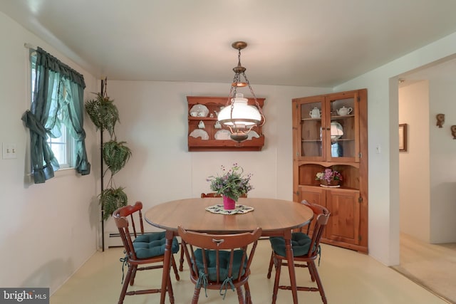 dining room featuring a baseboard heating unit