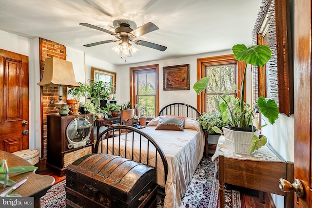bedroom with wood finished floors and ceiling fan