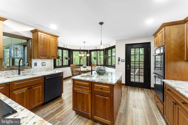 4025 Branches Ln, Doylestown, PA 18902 - kitchen featuring a sink, black appliances, and wood finished floors