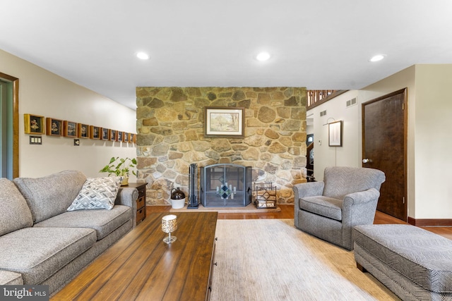 4025 Branches Ln, Doylestown, PA 18902 - living room featuring wood finished floors, visible vents, recessed lighting, baseboards, and a stone fireplace