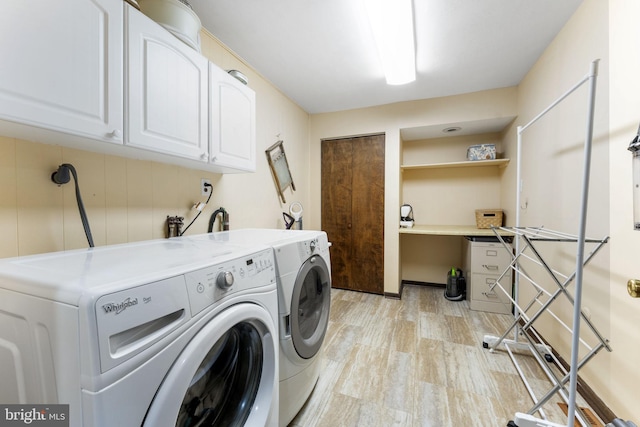 4025 Branches Ln, Doylestown, PA 18902 - clothes washing area with light wood-style flooring, cabinet space, and washer and dryer