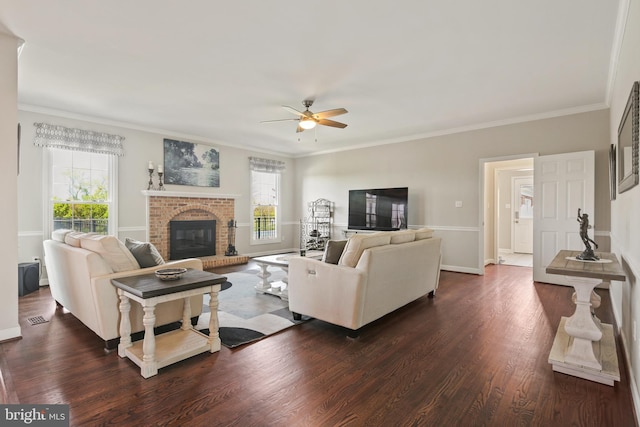 living area with ceiling fan, dark wood finished floors, baseboards, and a fireplace