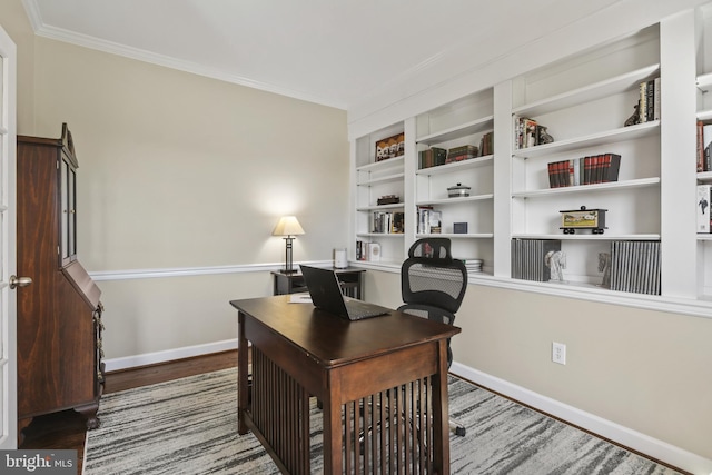 office area with crown molding, baseboards, built in features, and wood finished floors