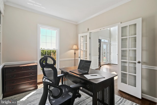 home office with crown molding, french doors, and wood finished floors