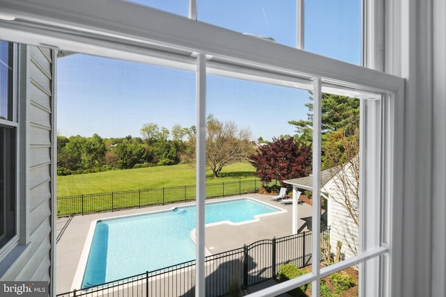view of pool featuring a fenced in pool, fence, a lawn, and a patio area