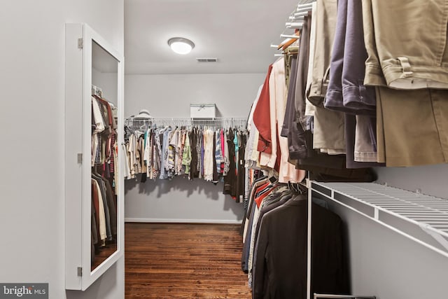 spacious closet with wood finished floors and visible vents