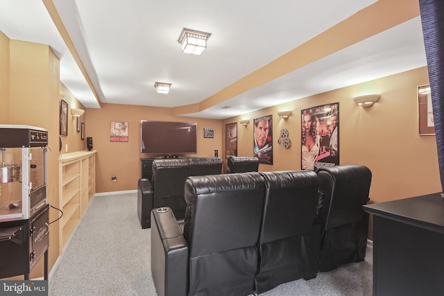 carpeted cinema with baseboards