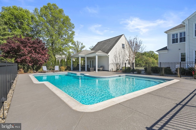 view of swimming pool with fence, a patio area, and a fenced in pool