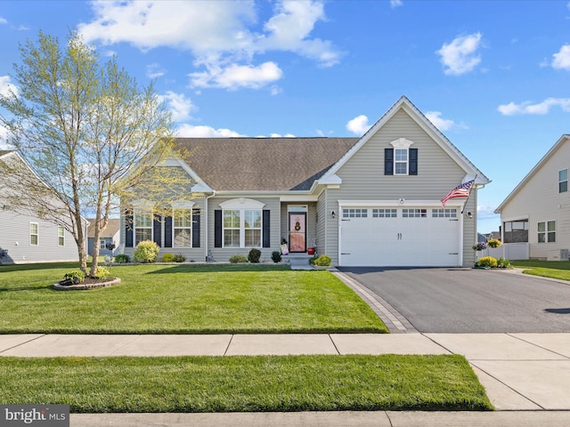 view of front facade featuring an attached garage, a shingled roof, a front lawn, and aphalt driveway