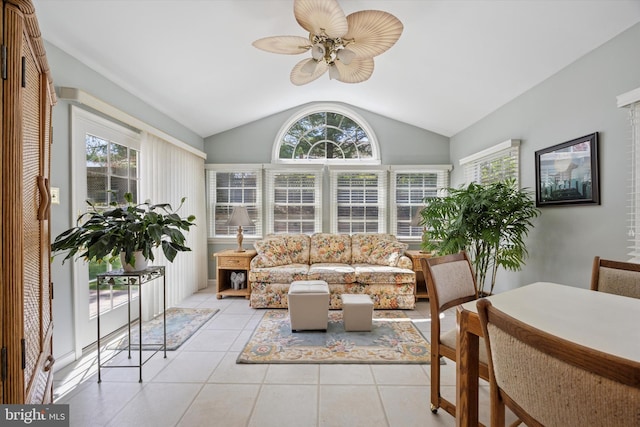 sunroom / solarium featuring tile patterned flooring and vaulted ceiling
