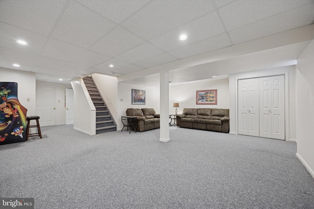 finished basement with carpet, baseboards, recessed lighting, and stairs