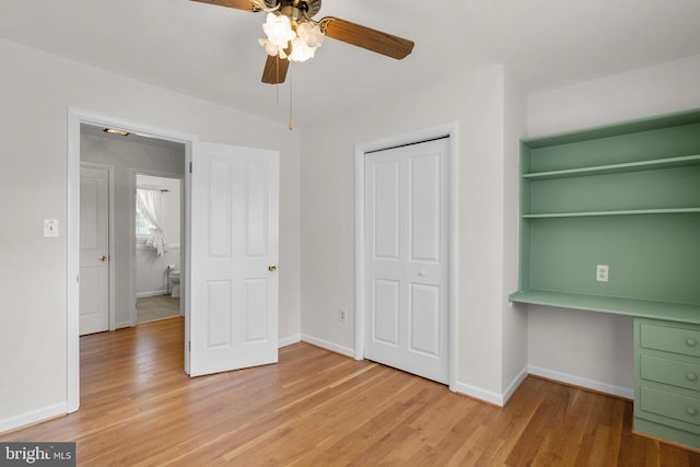 unfurnished bedroom with light wood-type flooring and baseboards