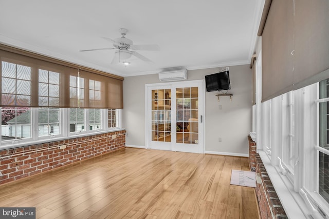 unfurnished sunroom with a wall unit AC