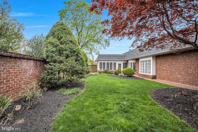 view of yard featuring fence