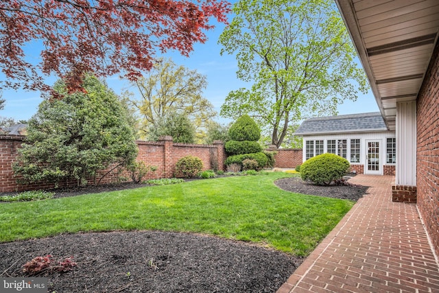 view of yard with a fenced backyard and a patio